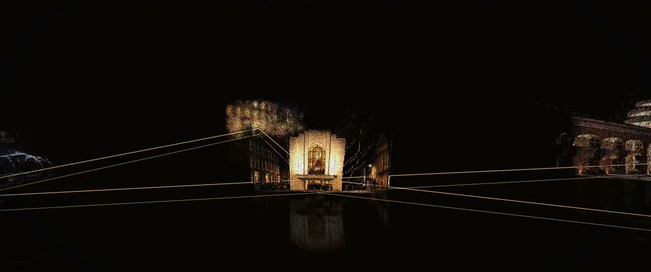Lit models of houses joined by lines of light across the dark